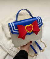 Bring the magic of anime into your everyday life with this Sailor Moon Anime Gold Chain Purse. Perfectly blending style, functionality, and fandom, this bag is a must-have for Sailor Moon, anime, and kawaii enthusiasts.
Made from soft PU leather, this bag is water-resistant and durable, protecting your belongings from spills and scratches. Its luxurious texture and resilient design ensure long-lasting use.